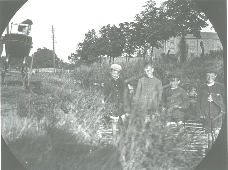 Boys paddling on The Green c1908